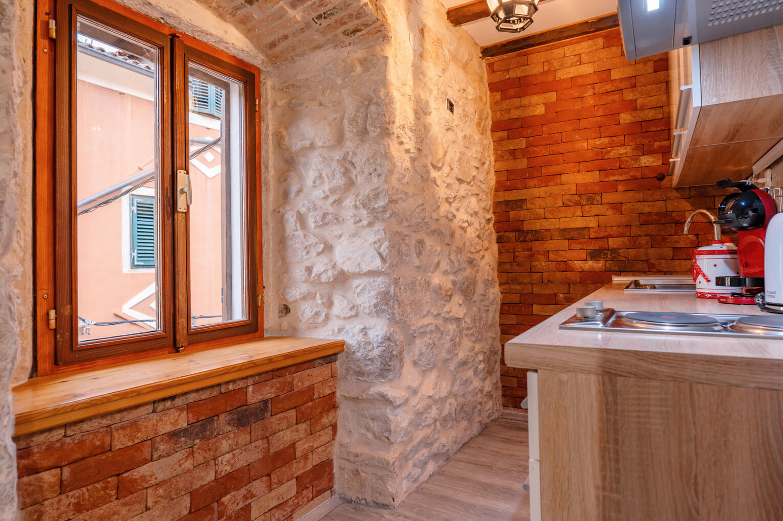 Kitchen with natural stone wall Kitchen with natural stone wall