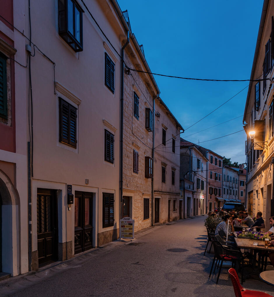 Old town street, in the center highlighting the position of the traditional Rustika stone house Old town street, in the center highlighting the position of the traditional Rustika stone house