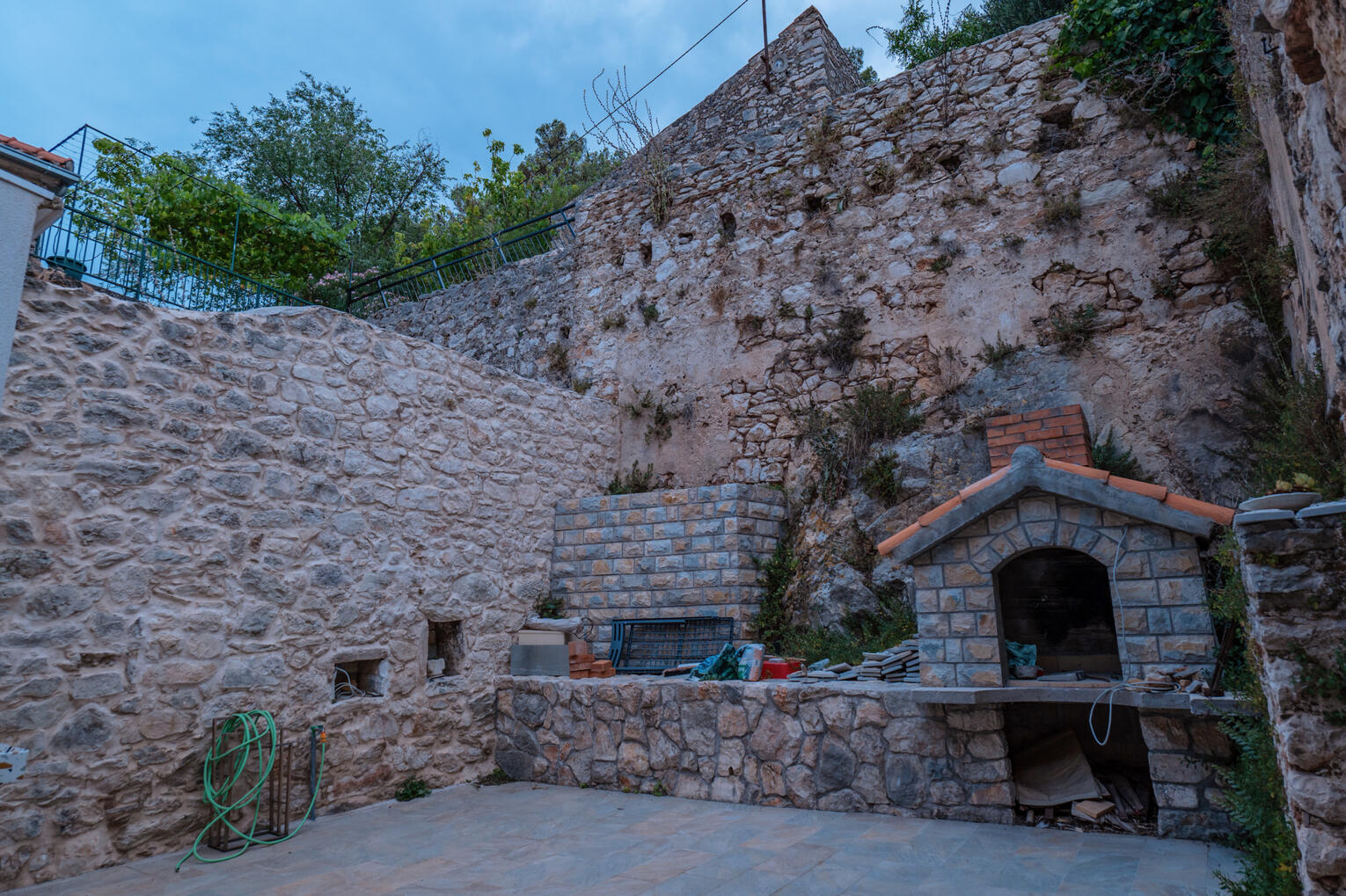 Outside terrace with stone grill Outside terrace with stone grill